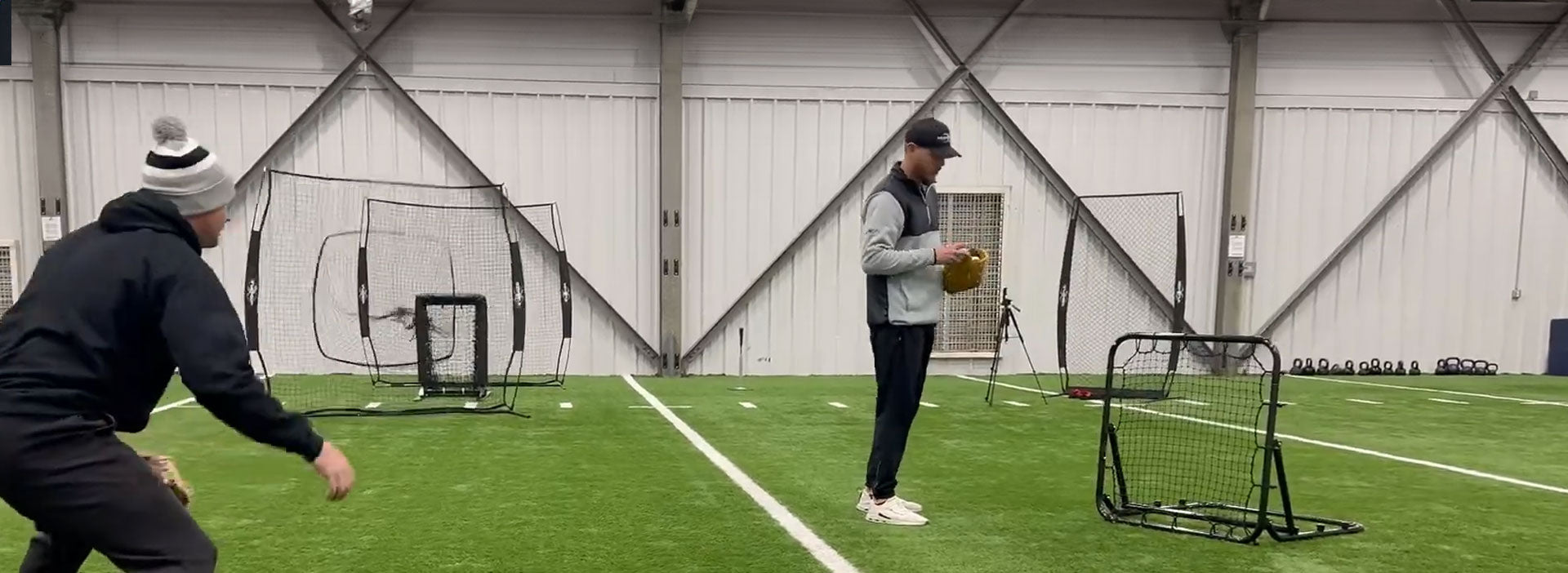 Parker throwing into the Web Bounder rebounder, sending a sharp ground ball to Tanner. 