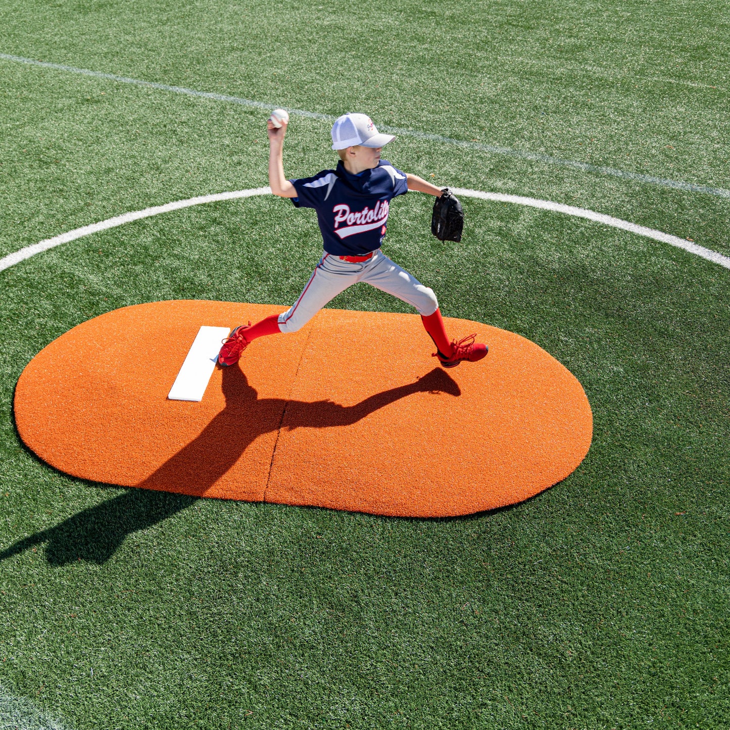 Pitching on a clay colored 6" Two-Piece Game Mound