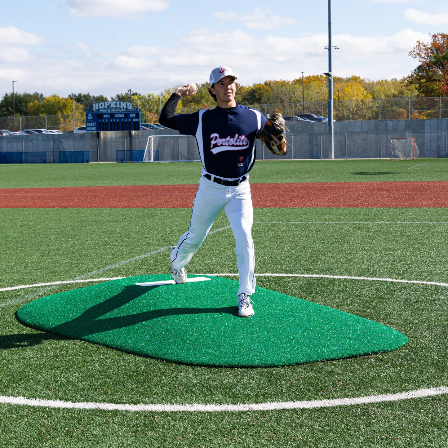 Pitcher Pitching on a Green Portolite Mound