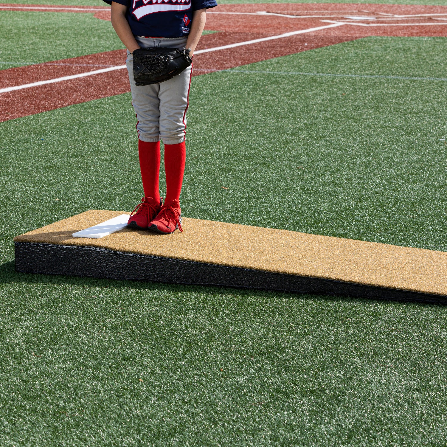 Junior Pitcher on a tan Practice Mound