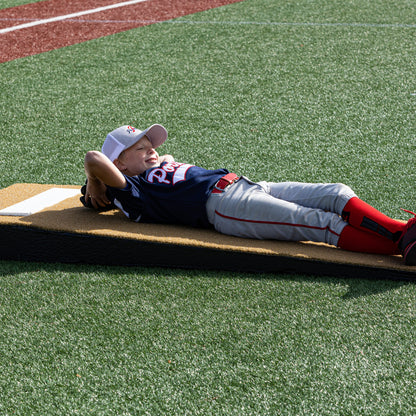 Young relaxing on a junior mound