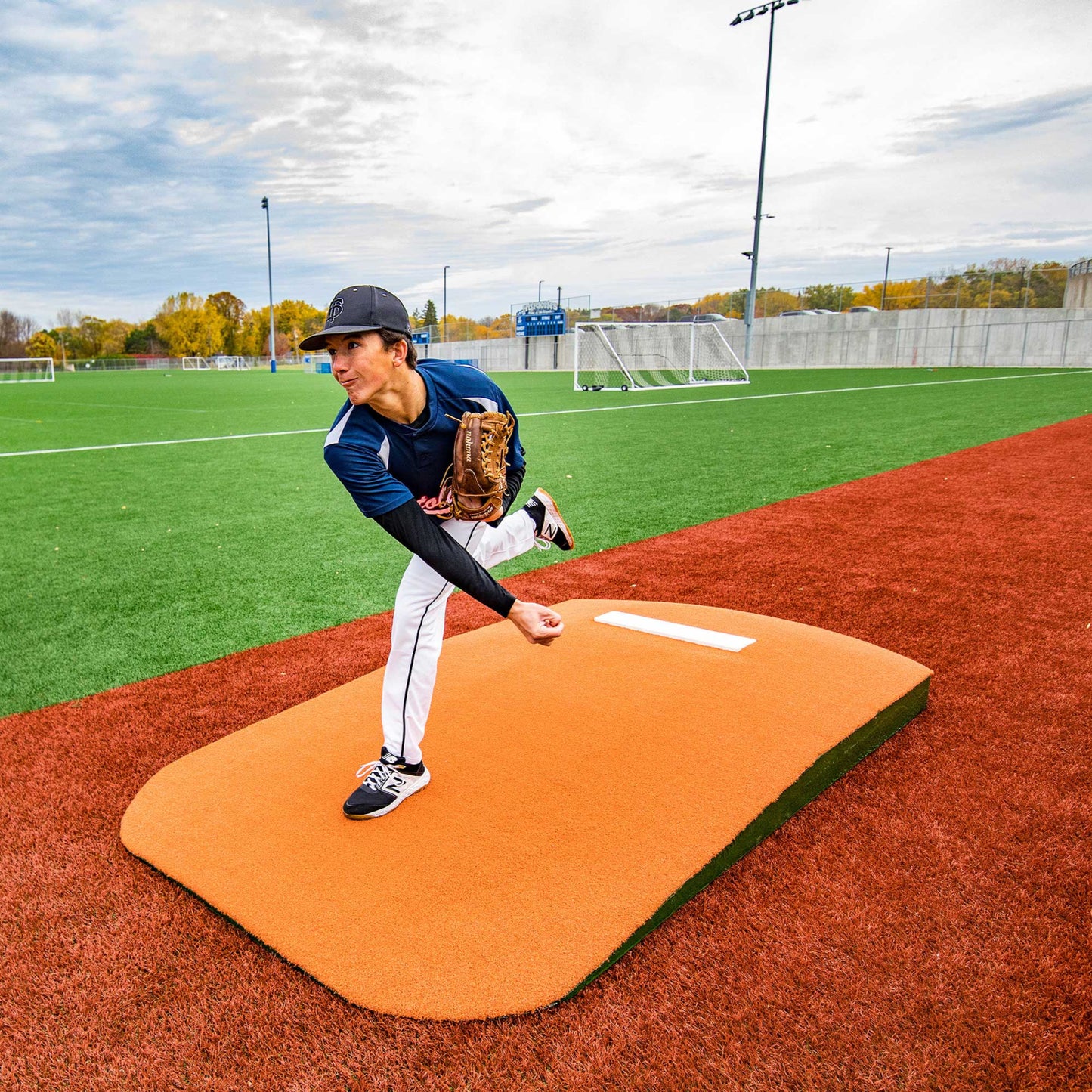 Pitcher using a Oversized One-Piece Practice Mound to practice